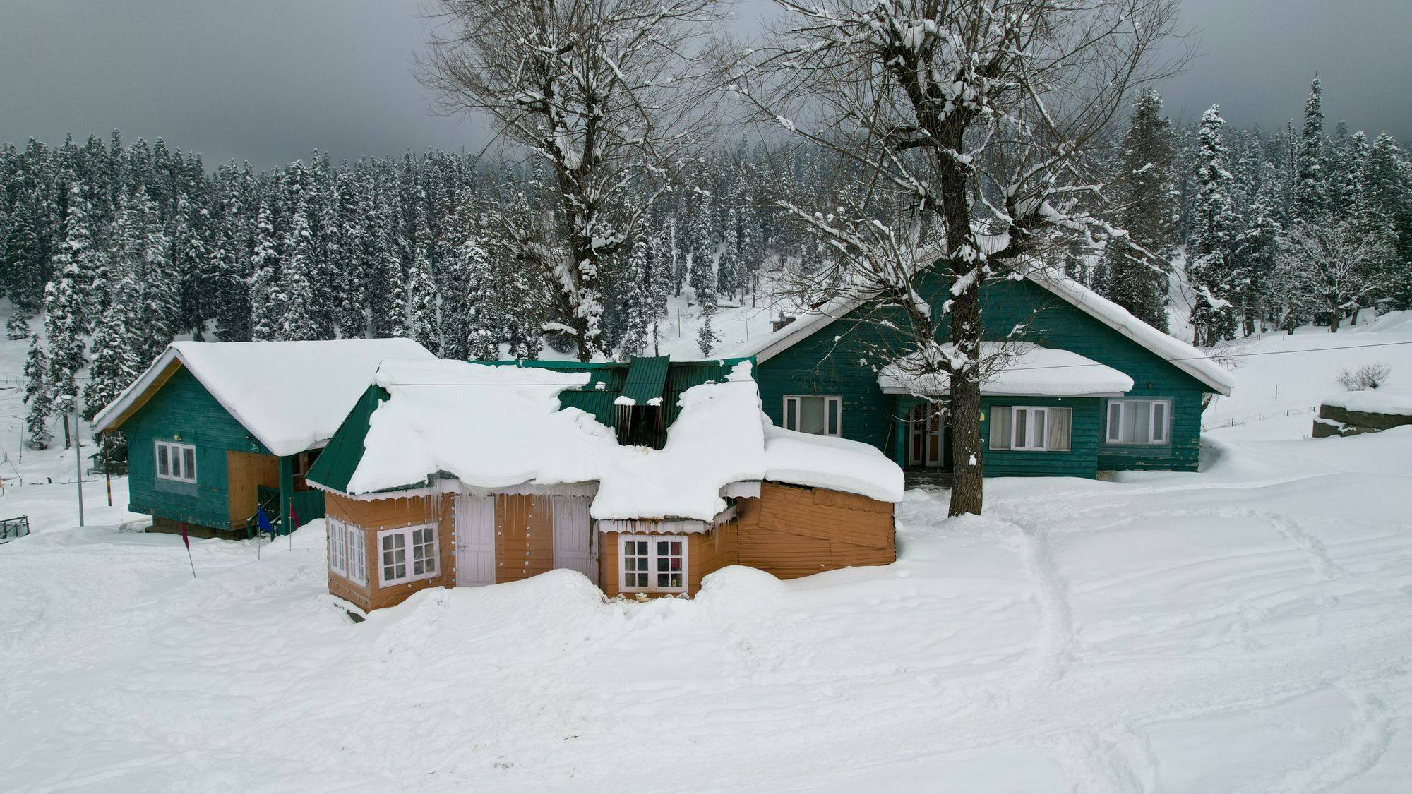Snow lying heavy on house roofs in Gulmarg