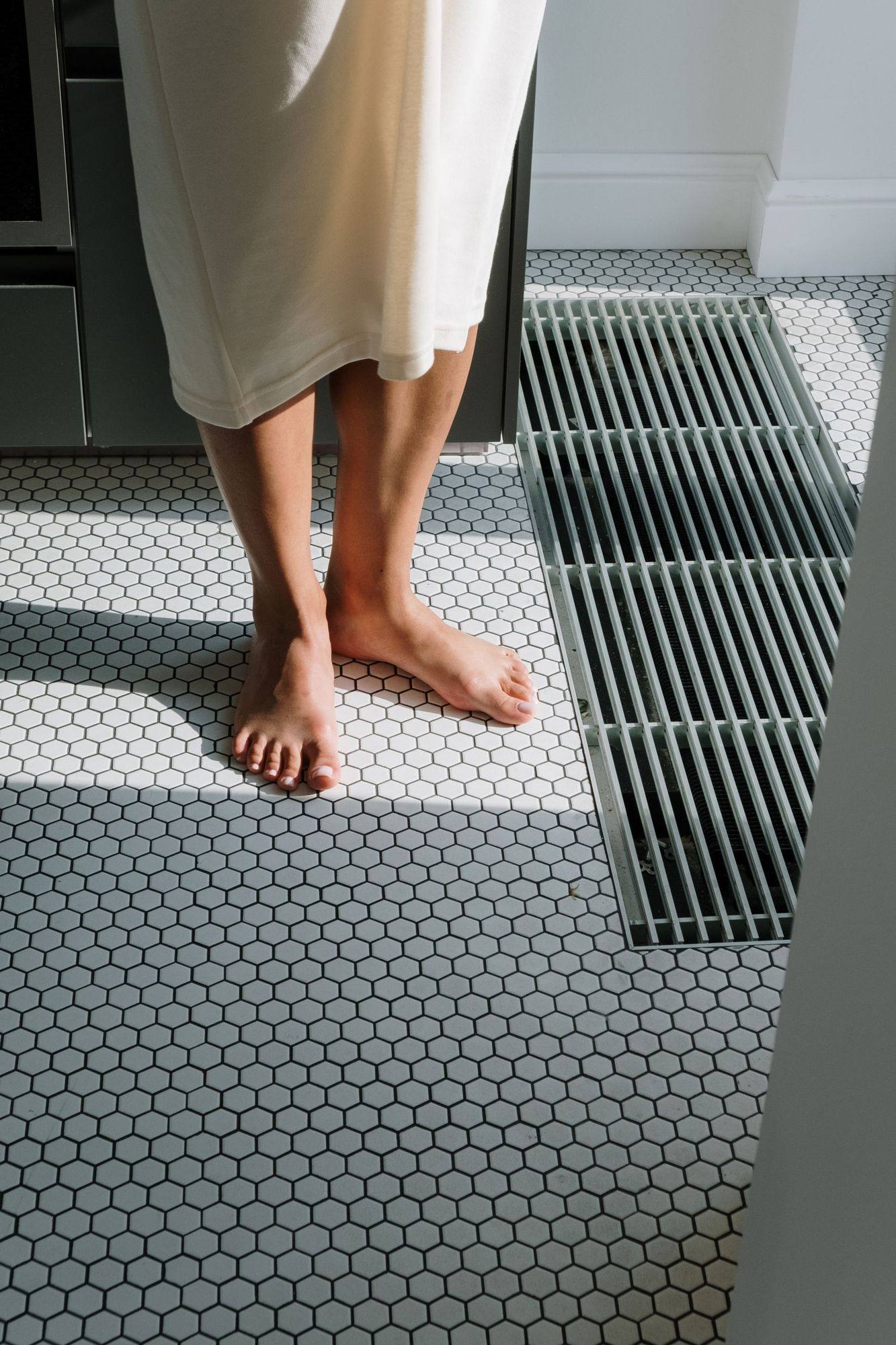 A tiled floor illustrating the finish that conceals the waterproofing below